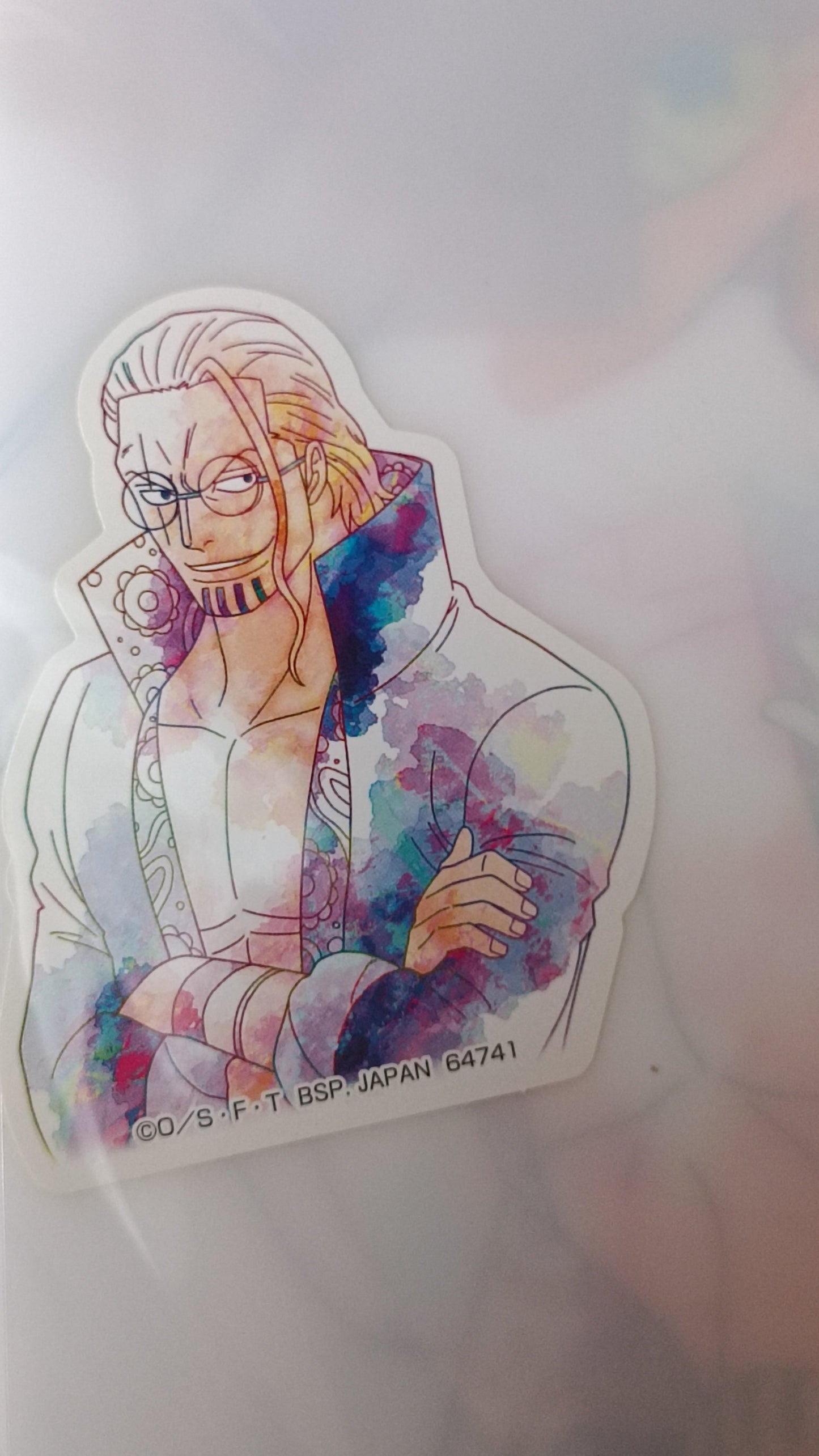 Colorful sticker of a stylized character on a white background