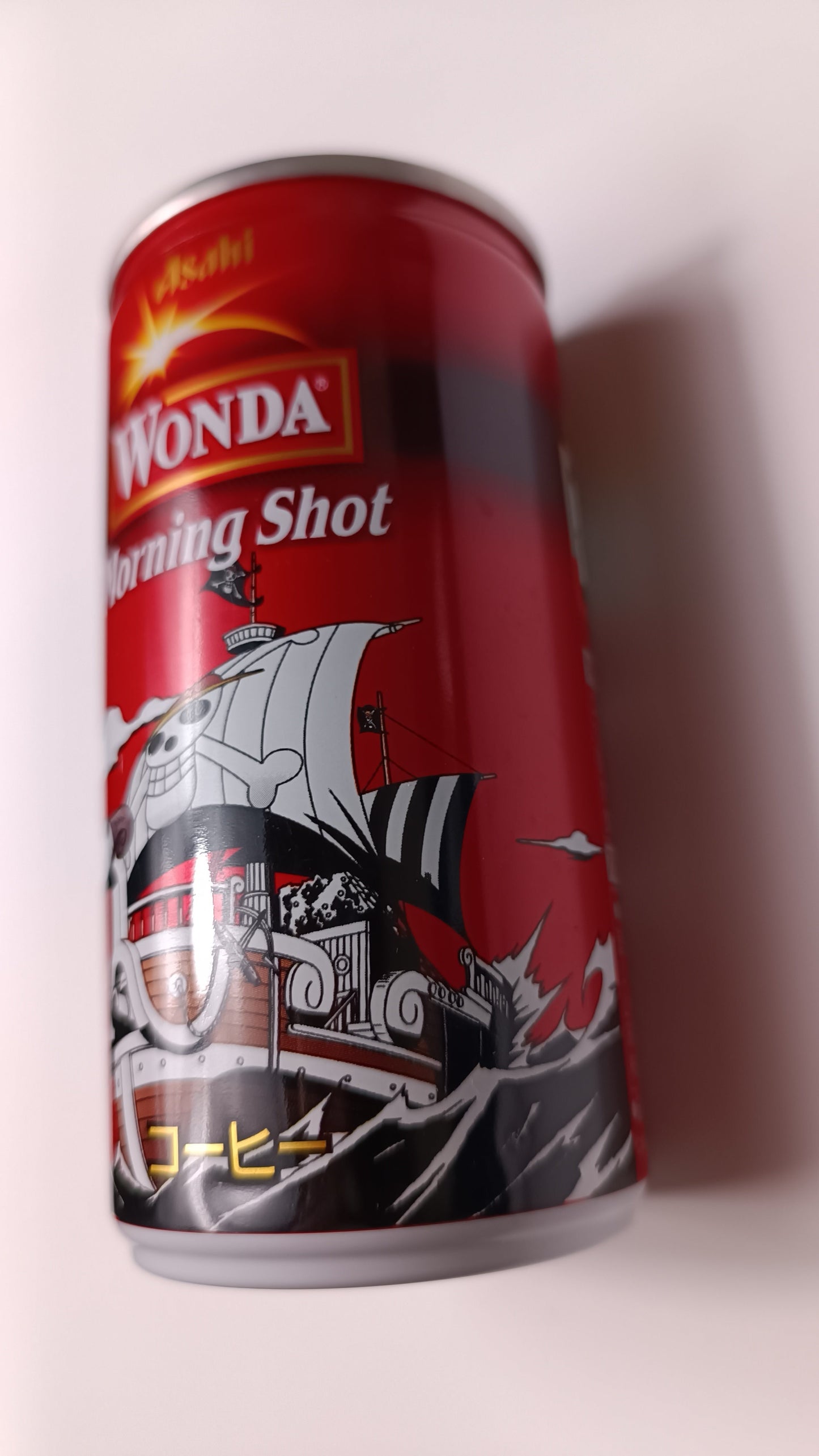 Red energy drink can with graphic design on a white background