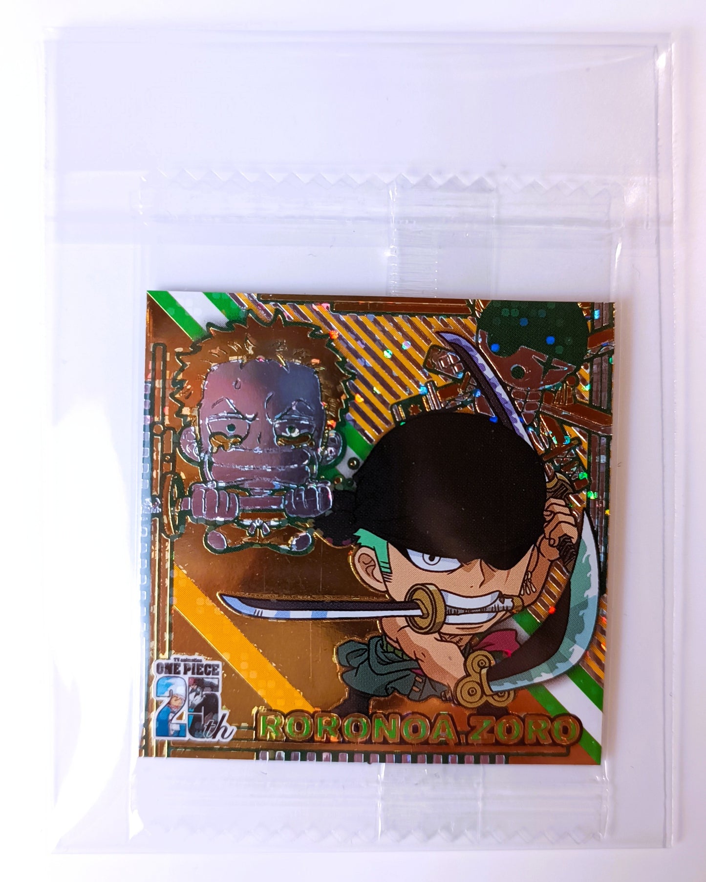 Card featuring an animated character with a sword, enclosed in clear packaging.