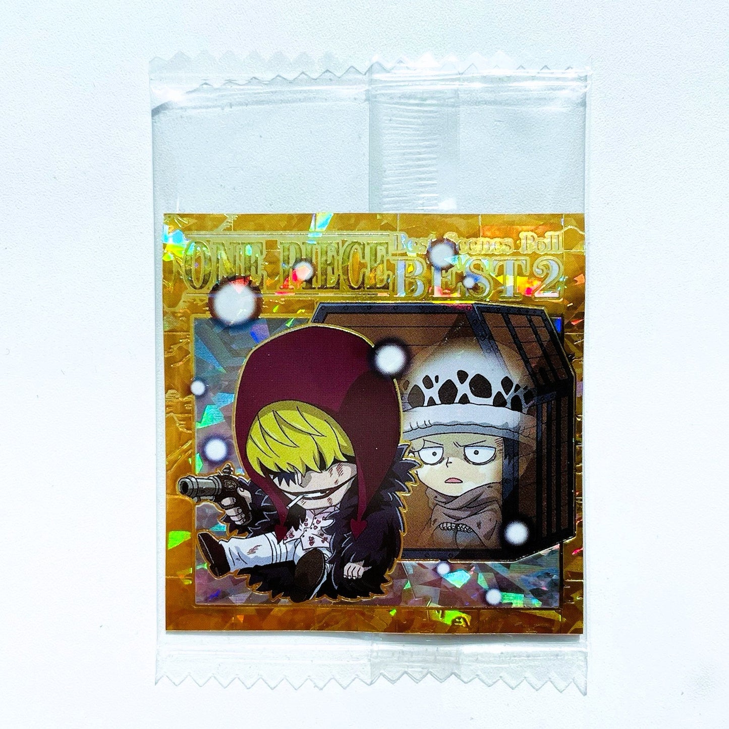 Packaged collectible card with anime-style characters on a white background