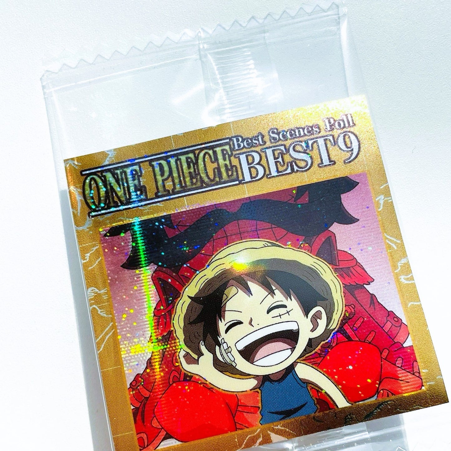 Packaging of 'One Piece Best Scenes Poll BEST 9' with a character illustration on a white background