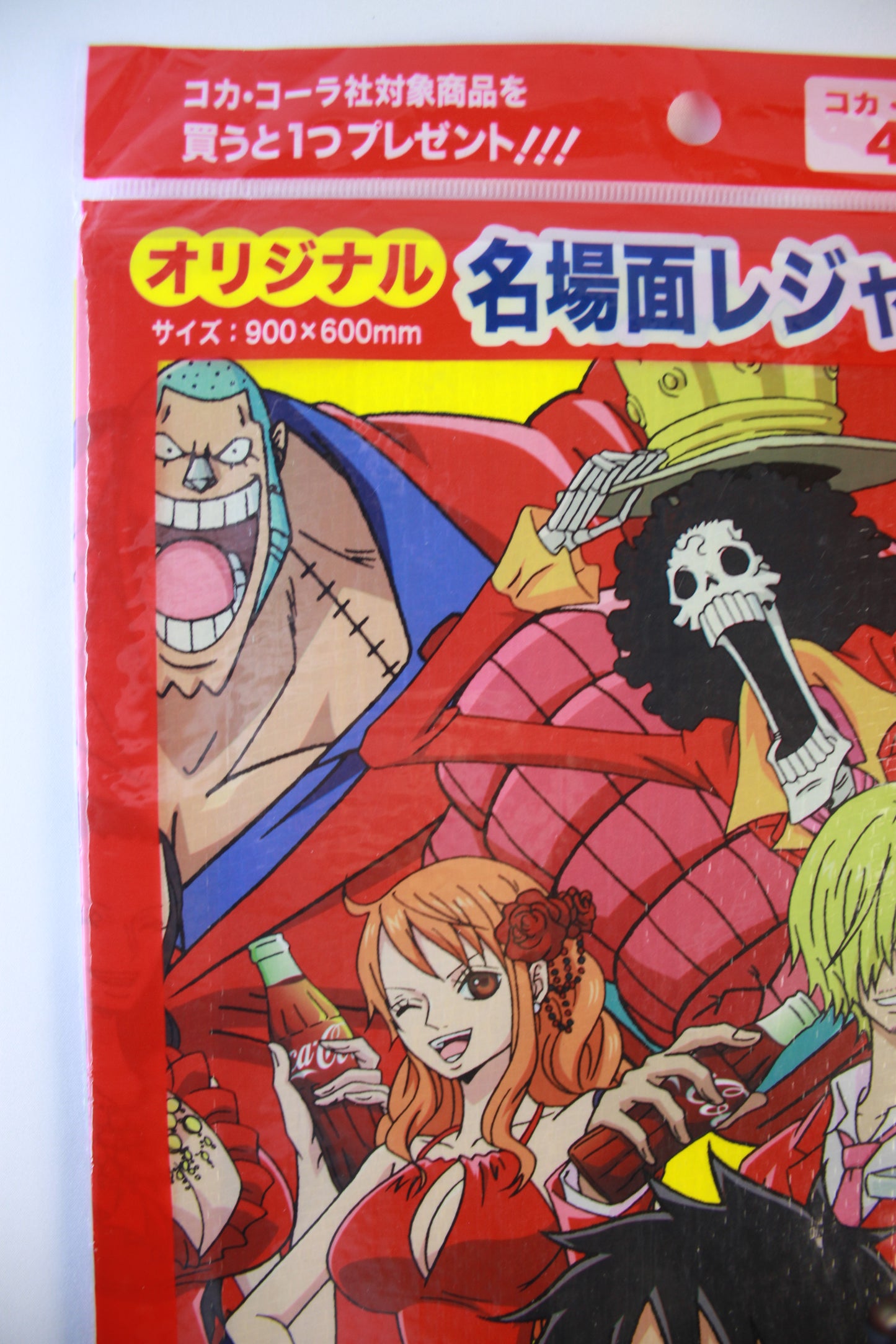 Anime-style packaging with characters and text on a red background