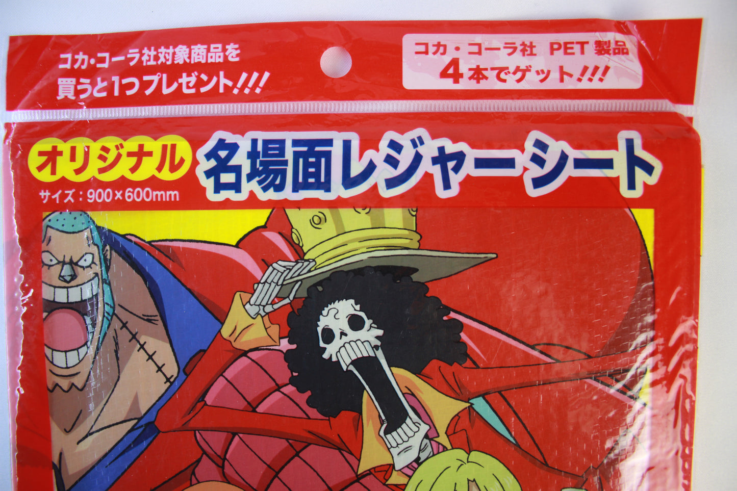 Packaged product with anime-style illustration on a red background