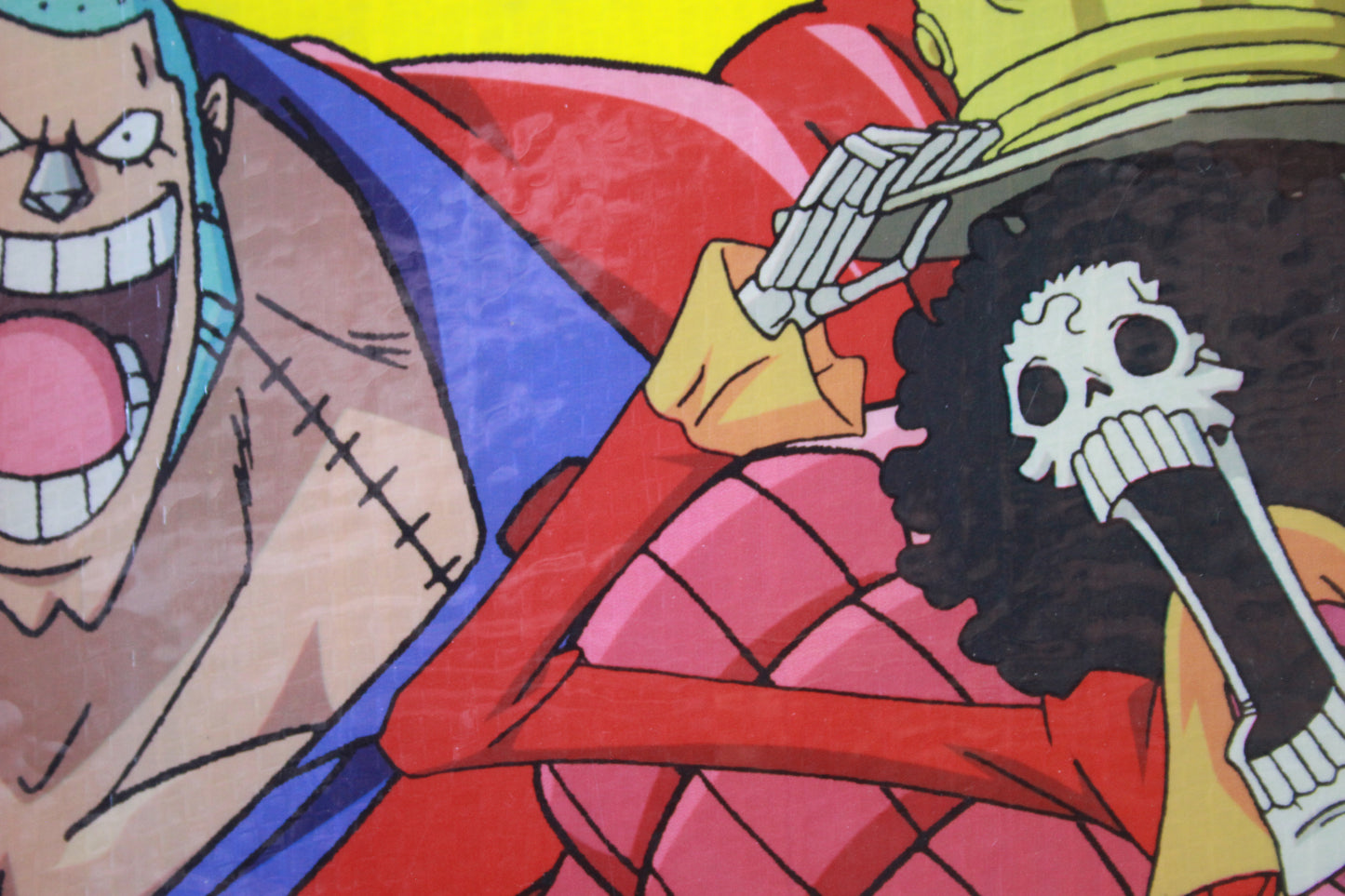Cartoon character with a red outfit and blue headband, holding a skeleton hand.