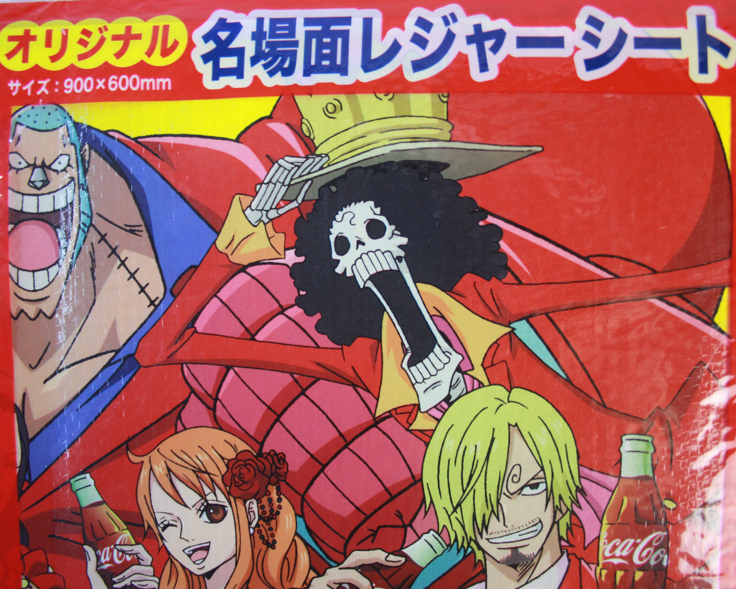 One Piece Anime character-themed product packaging with Coca-Cola branding on a red background
