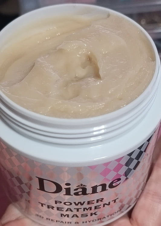 Diane power treatment mask jar held by a hand