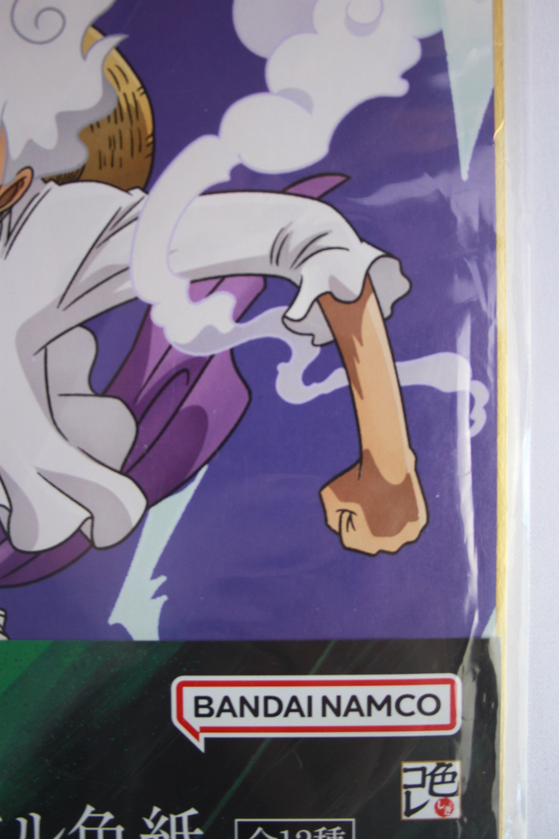 Product packaging with a character holding a bone and Bandai Namco logo.