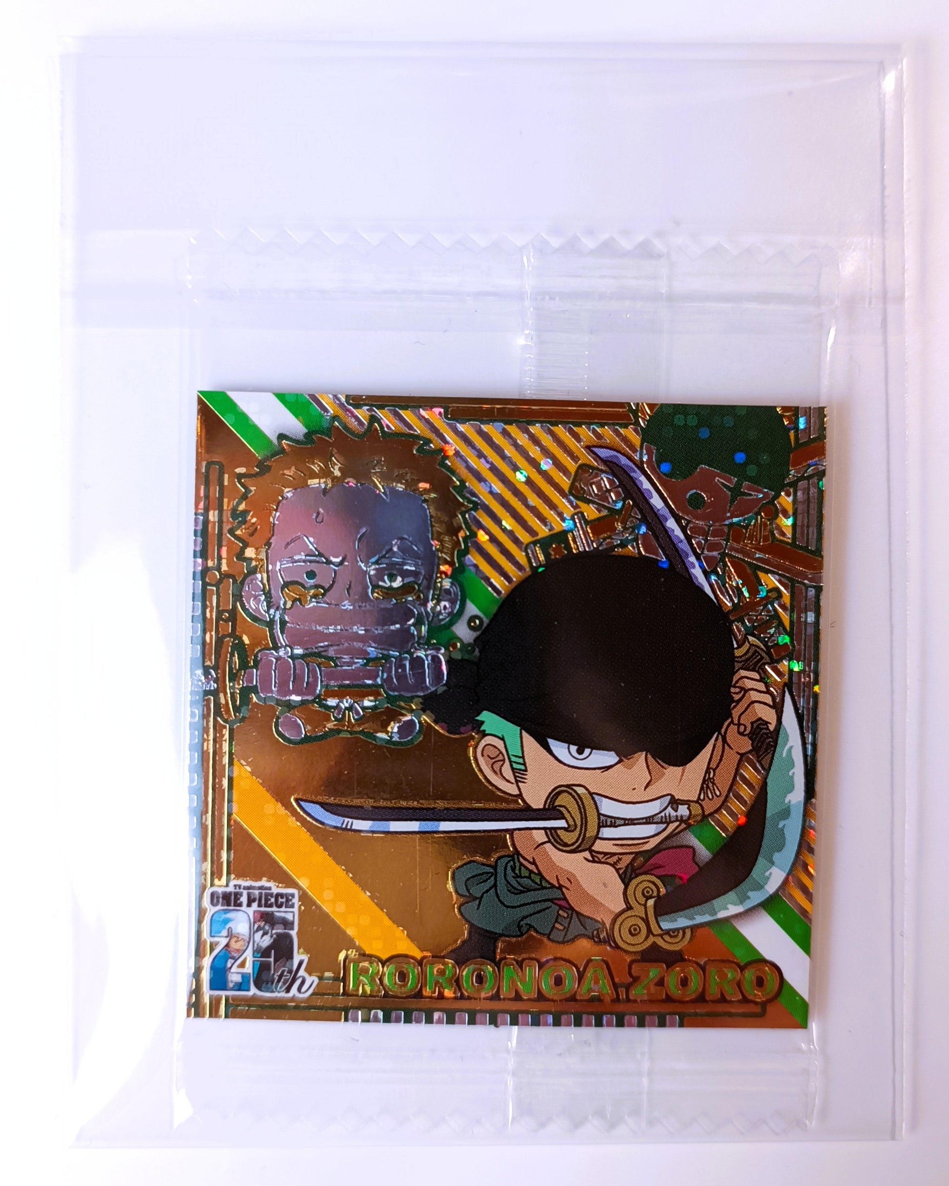 Card featuring an animated character with a sword, enclosed in clear packaging.